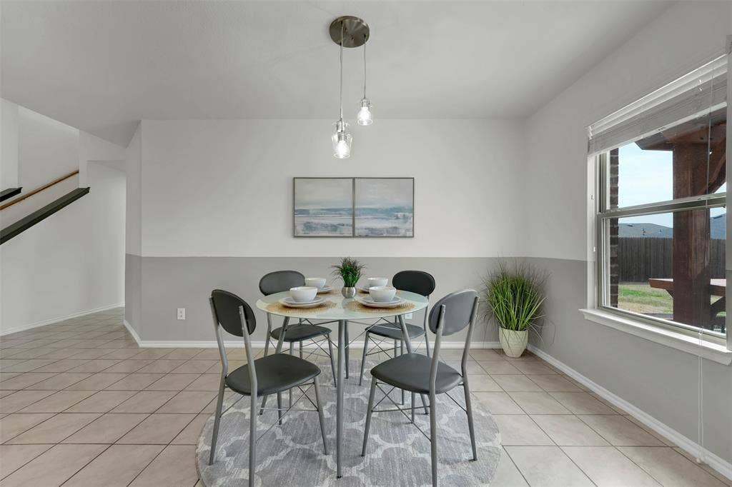 1121 Basswood Lane, Royse City, TX 75189 Dining room with light tile patterned floors and baseboards