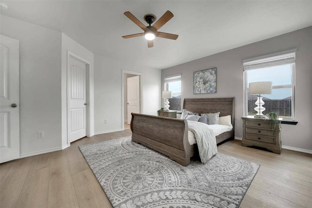 1121 Basswood Lane, Royse City, TX 75189 Bedroom featuring wood finished floors, baseboards, and ceiling fan