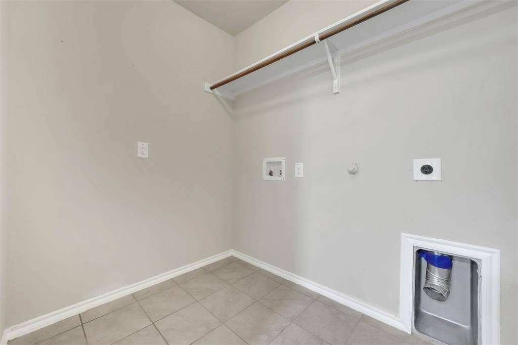 1121 Basswood Lane, Royse City, TX 75189 Washroom with electric dryer hookup, hookup for a washing machine, baseboards, and laundry area