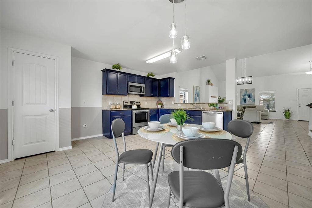 1121 Basswood Lane, Royse City, TX 75189 Dining space with light tile patterned flooring, visible vents, and a wealth of natural light
