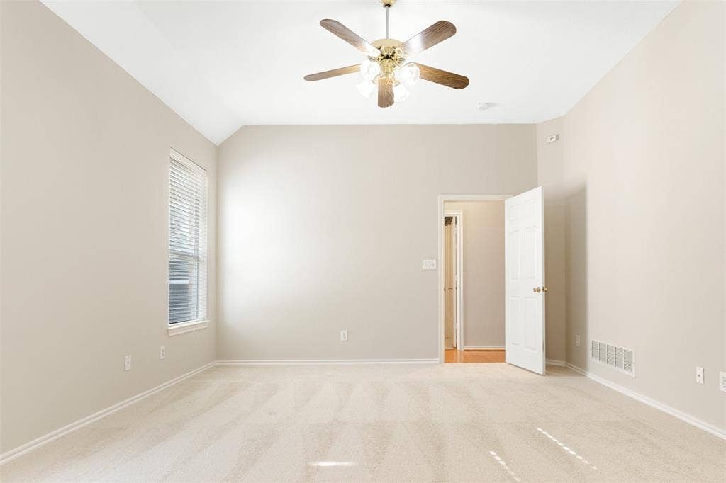 2803 Pheasant Run Drive, McKinney, TX 75072 Vaulted ceiling, neutral wall tones, carpeted flooring, multi-light ceiling fan, and window featuring horizontal blinds