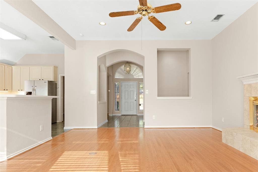 2803 Pheasant Run Drive, McKinney, TX 75072 Interior featuring wood-finish flooring, recessed lighting, a ceiling fan, a built-in recessed wall niche, and an arched entryway
