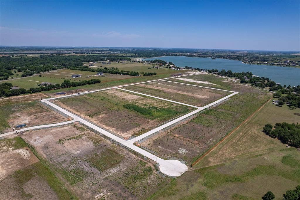 Expansive undeveloped land parcels featuring paved infrastructure, street lighting, and proximity to the waterfront
