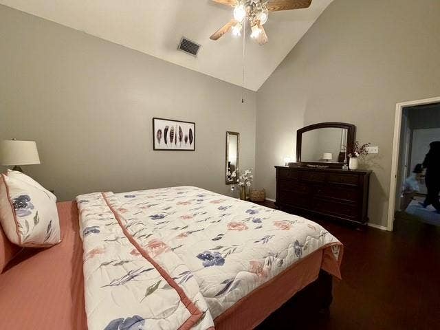 11159 Covey Lane, Frisco, TX 75035 Vaulted ceiling featuring a central wood-finish ceiling fan with integrated lighting and dark-toned wood-finish flooring