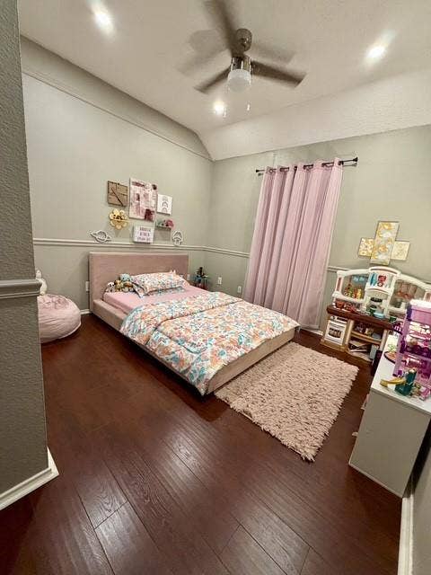 11159 Covey Lane, Frisco, TX 75035 Room featuring wood-finish flooring, vaulted ceilings, chair rail molding, and a central ceiling fan with integrated lighting