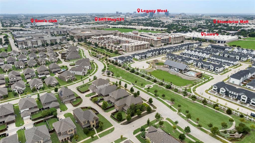 9829 Sharps Drive, Frisco, TX 75035 Aerial perspective of a suburban community featuring residential cul-de-sacs, expansive green spaces, a common area swimming pool, and established landscaping