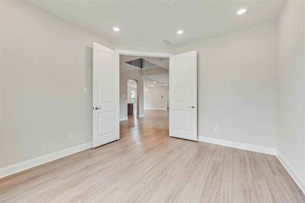 9829 Sharps Drive, Frisco, TX 75035 Interior space featuring wood-finish flooring, recessed lighting, and double-panel doors