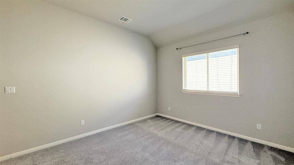 2937 Mossy Springs Drive, Leander, TX 78641 Neutral-toned room featuring high vaulted ceilings, wall-to-wall carpeting, and a window with horizontal blinds