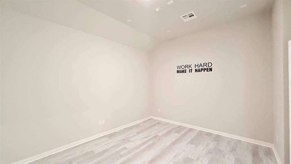 2937 Mossy Springs Drive, Leander, TX 78641 Room featuring high vaulted ceilings, neutral wall tones, and wood-finish flooring