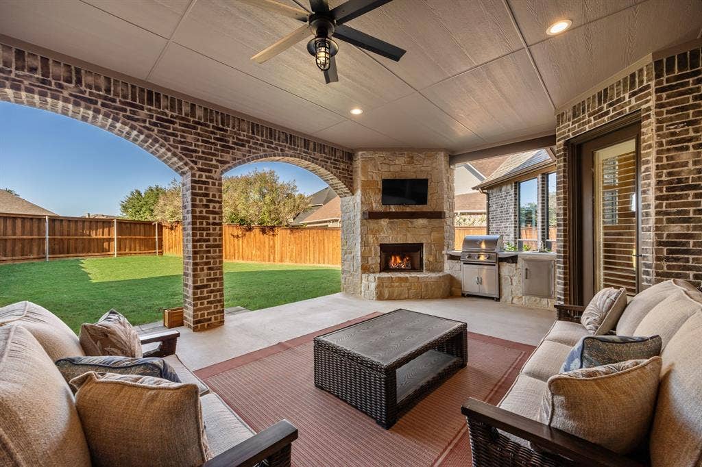 Beautiful Patio with Stone Fireplace and Grill Station