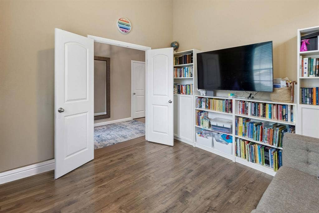 Another look at the office, highlighting the beautiful French doors that add an elegant touch and provide a welcoming entry to the space.