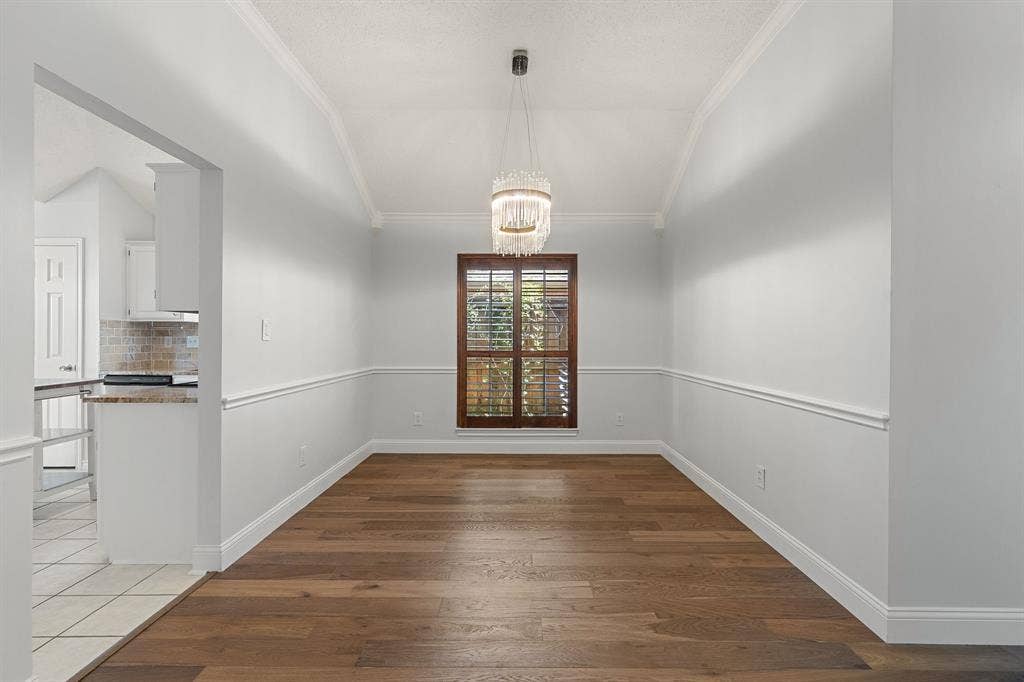 11414 Ocean Road, Frisco, TX 75035 Dining room with wood shutters and gorgeous light fixture