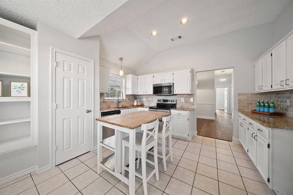 11414 Ocean Road, Frisco, TX 75035 Kitchen with island has lots of cabinet and counter space