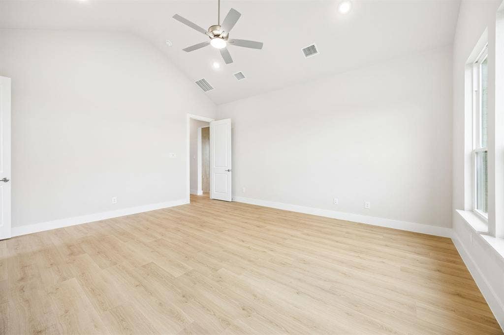 108 Swan Lake Drive, Waxahachie, TX 75165 Vaulted ceilings, wood-finish flooring, recessed lighting, and a neutral color palette