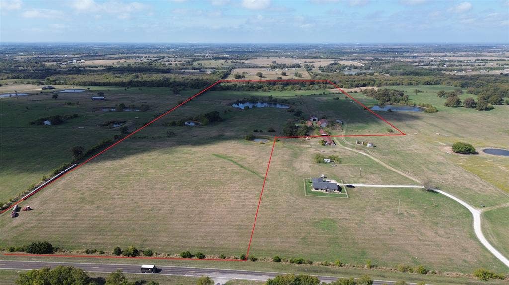 East looking west. Red property lines were added and are approximate.