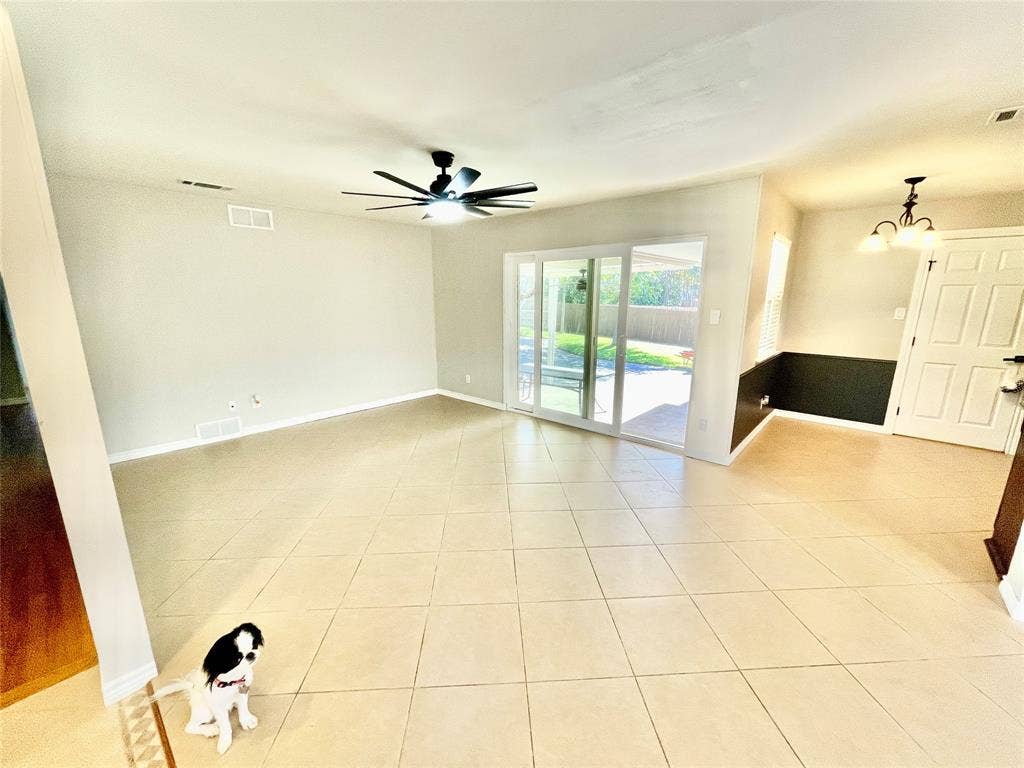 530 E Spring Valley Road, Richardson, TX 75081 Den and small dining room. Large sliding glass door to backyard. Puppy does not come with house.