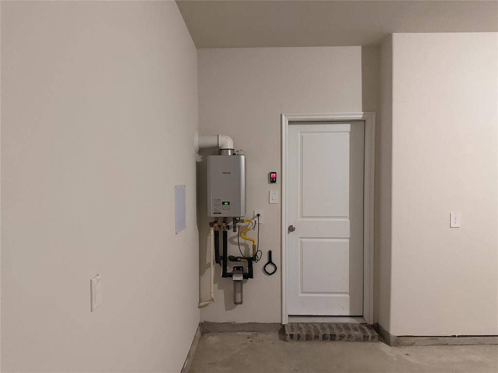Tankless water heater with mounted digital control unit and dedicated water filtration system