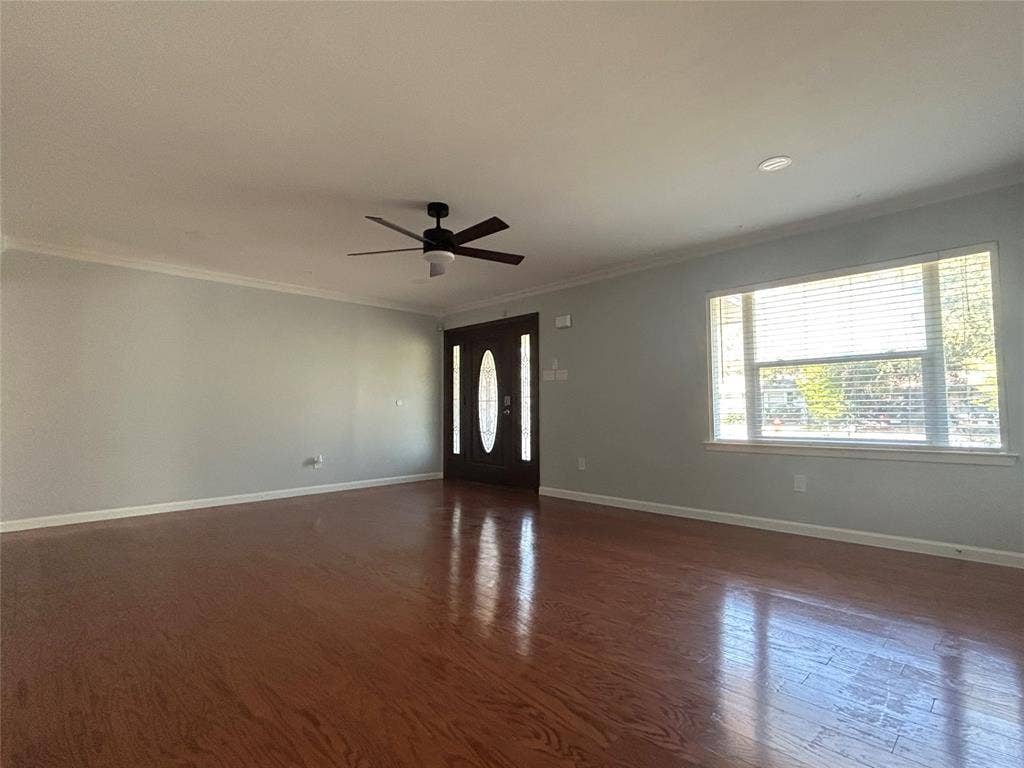 3136 Chatsworth Drive, Farmers Branch, TX 75234 Living area featuring wood-finish flooring, recessed ceiling lighting, a dark-finish ceiling fan, and a front entry door with an oval glass insert