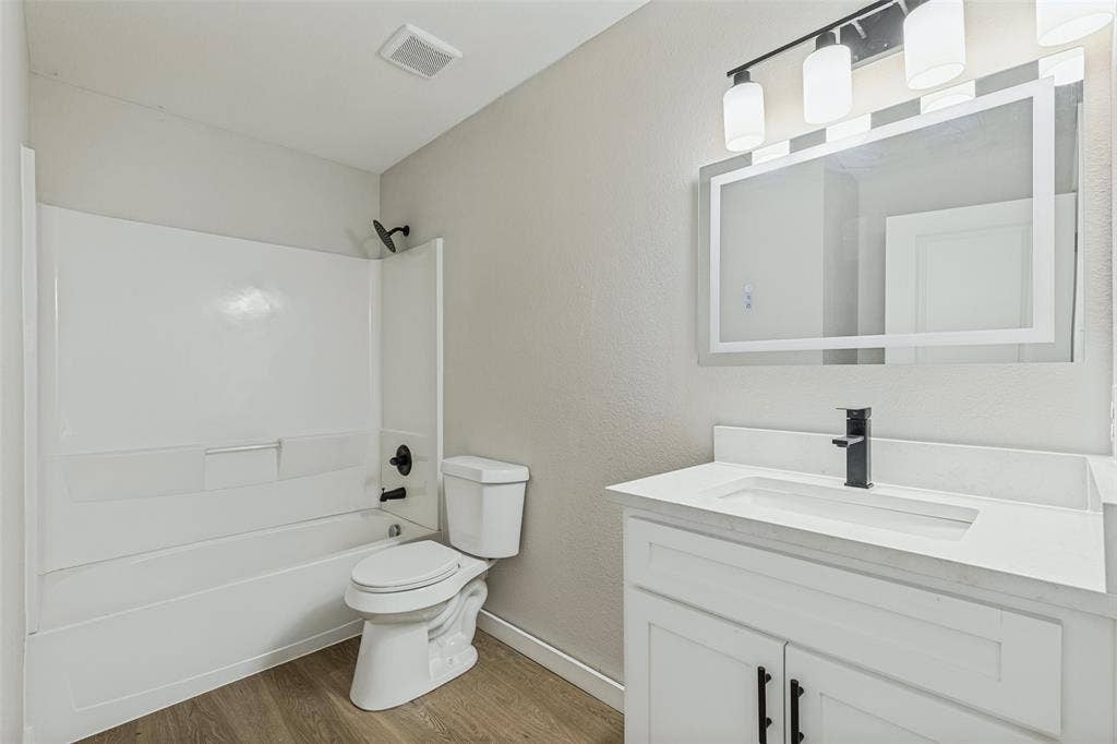 4603 Spring Garden Street, Dallas, TX 75215 En suite primary bathroom with new vanity, mirror, and lights