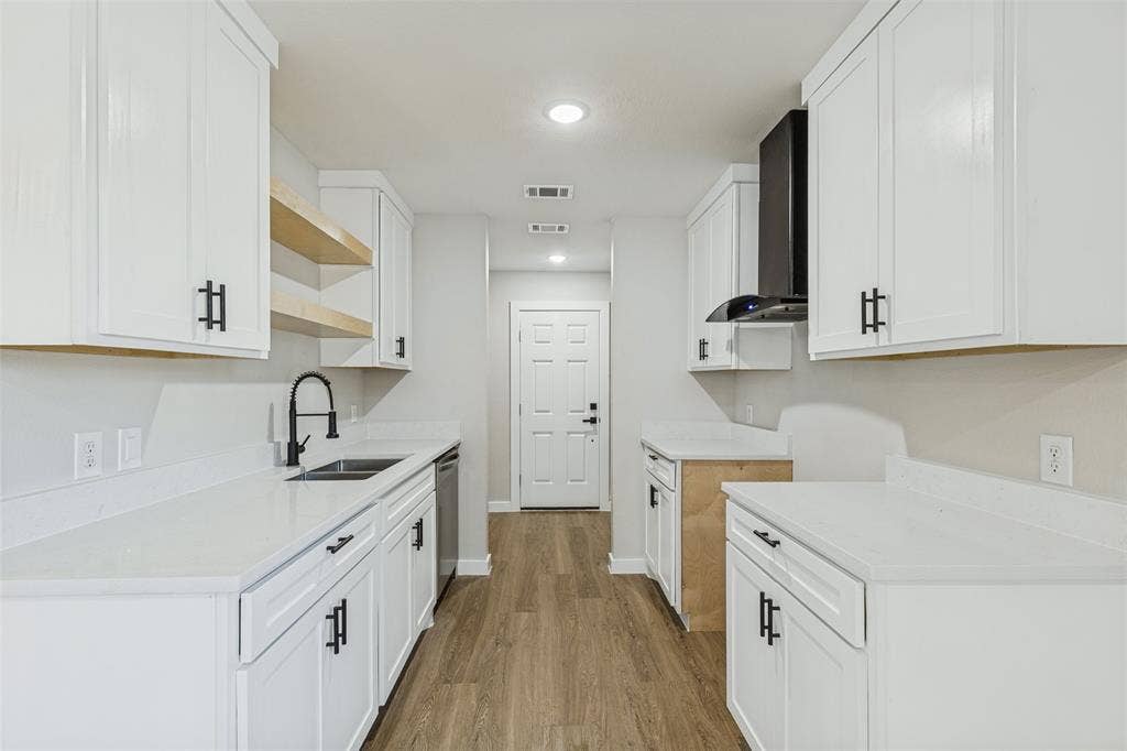 4603 Spring Garden Street, Dallas, TX 75215 Kitchen featuring new white cabinetry and light-toned quartz. Range will be installed upon purchase!