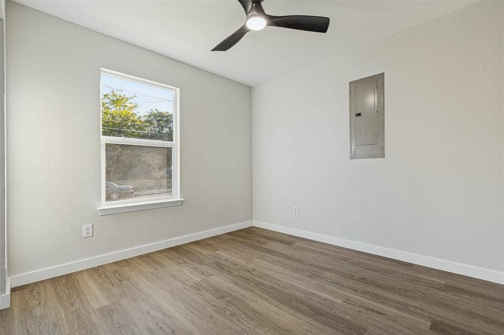 4603 Spring Garden Street, Dallas, TX 75215 Room featuring luxury vinyl plank and ceiling fan