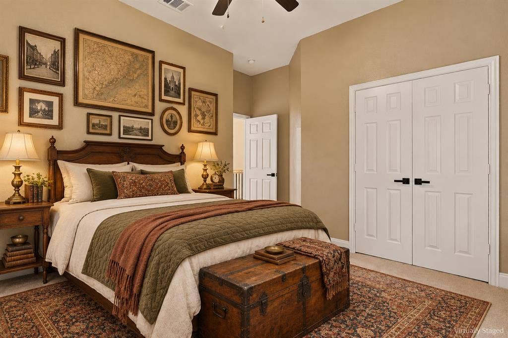 511 Clover Leaf Lane, McKinney, TX 75072 Vaulted ceiling with a central paddle fan, neutral wall paint, and white double-panel closet doors featuring matte black hardware
