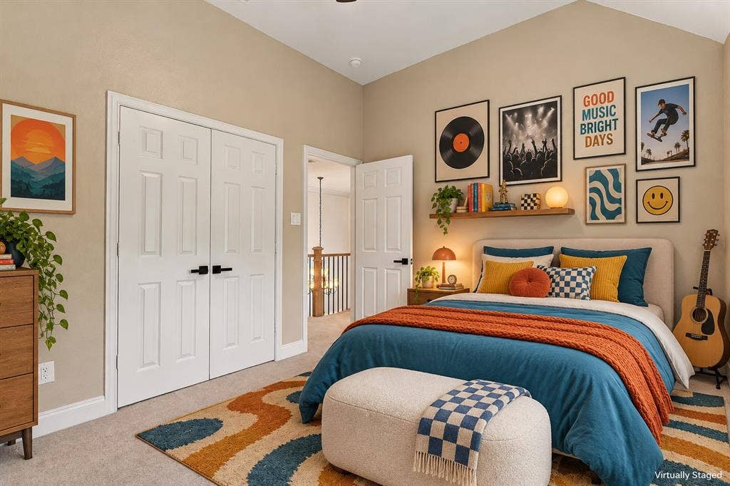 511 Clover Leaf Lane, McKinney, TX 75072 Vaulted ceilings, neutral wall tones, six-panel doors with matte black hardware, and wall-mounted wooden shelving
