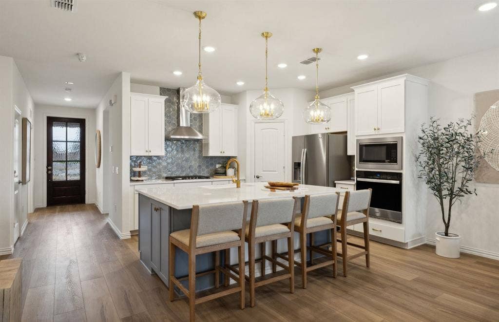 1433 Holmes Street, Celina, TX 75009 *Model Representation - Spacious kitchen with eat-in bartop island
