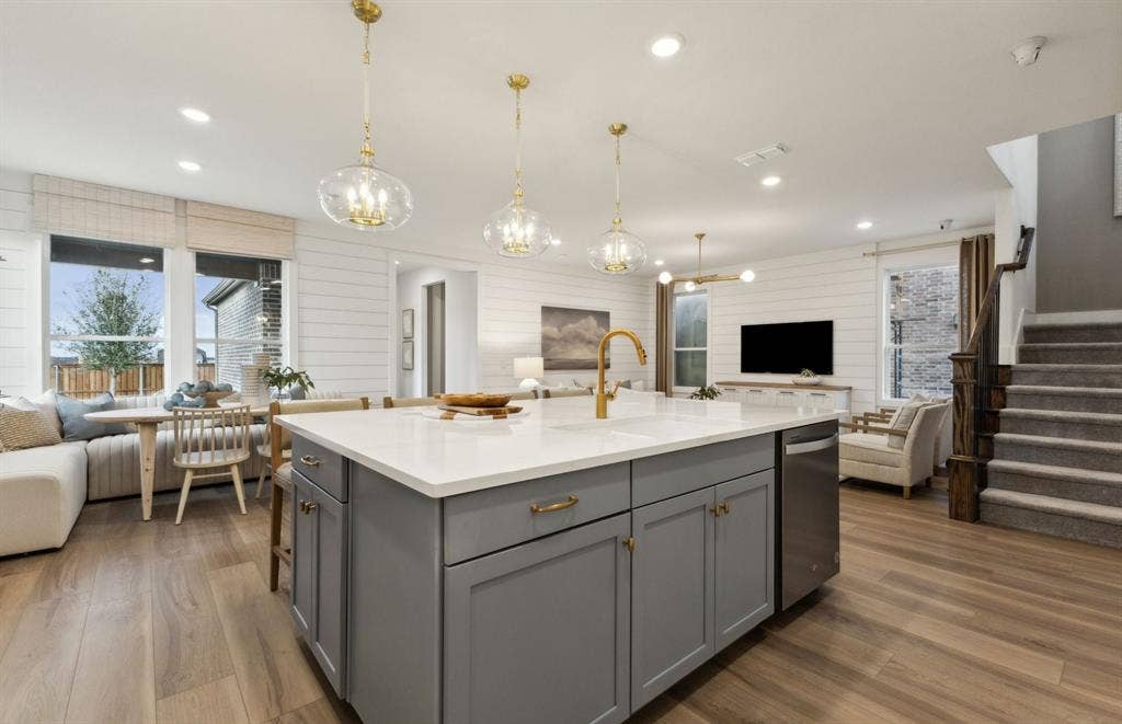 1433 Holmes Street, Celina, TX 75009 *Model Representation - Large island gathering room and dining areas overlooking
