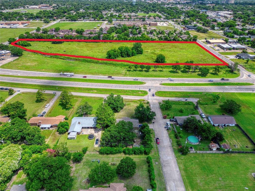 0000 King Street, Greenville, TX 75401 Expansive vacant land parcel featuring significant open acreage and clusters of mature trees