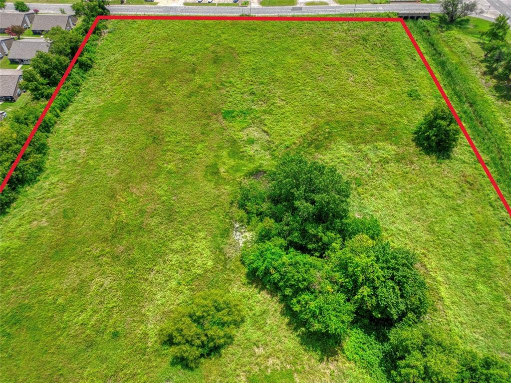 0000 King Street, Greenville, TX 75401 Expansive parcel of land featuring open grassy terrain and mature trees