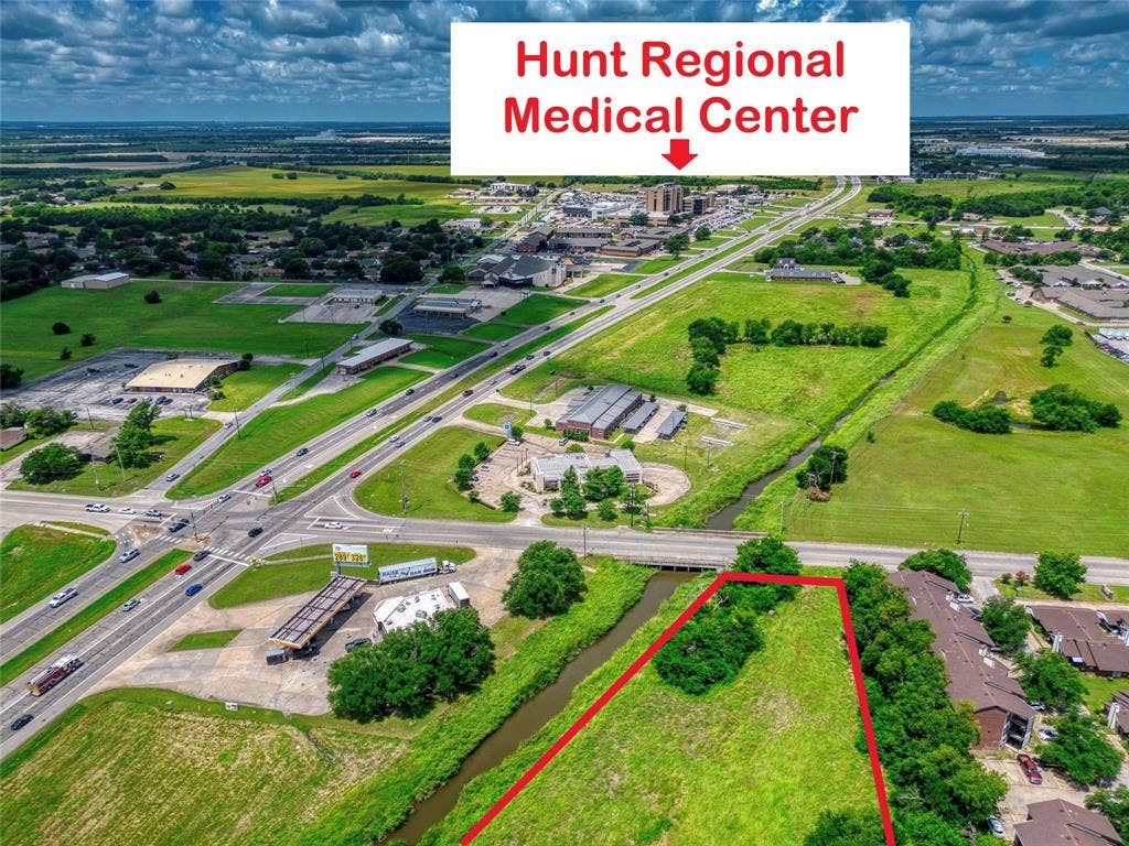 0000 King Street, Greenville, TX 75401 Aerial perspective of vacant land featuring defined boundaries, proximity to arterial roads, and established perimeter vegetation
