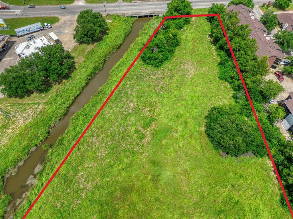 0000 King Street, Greenville, TX 75401 Expansive parcel of land featuring natural vegetation and clusters of mature trees
