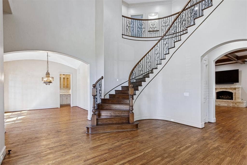 6467 Orchid Lane, Dallas, TX 75230 High ceilings, hardwood floors, and a graceful staircase welcome you to the interior with an open flow.