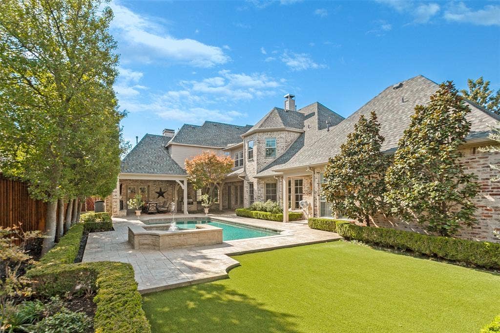 6467 Orchid Lane, Dallas, TX 75230 Lovely turfed area beyond pool for play or pets!