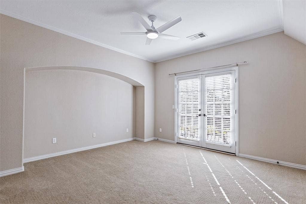 6467 Orchid Lane, Dallas, TX 75230 Upstairs bedroom with French doors to Juliette balcony. All bedrooms are ensuite and have walk-in closets