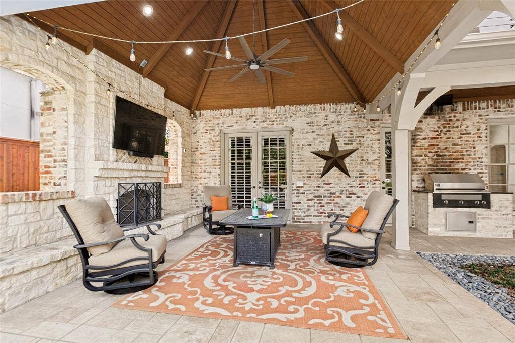 6467 Orchid Lane, Dallas, TX 75230 The outdoor Living Area is designed for virtual year-round enjoyment with a cedar plank roof, fireplace, TV, and Infrared Elite Grill.