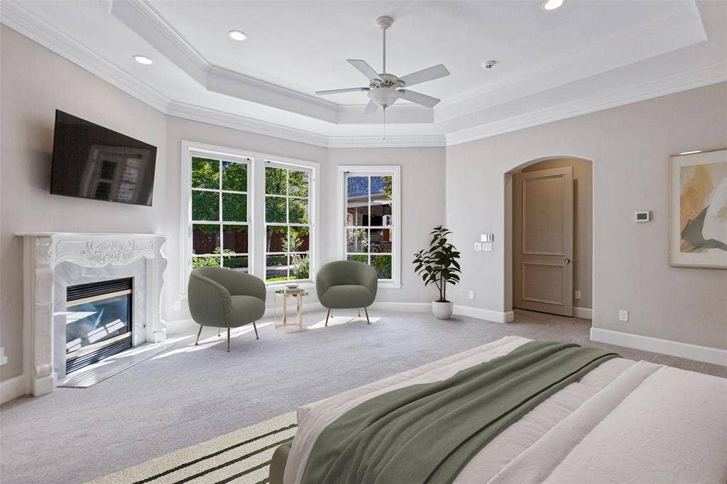 6467 Orchid Lane, Dallas, TX 75230 The Primary Bedroom is a true retreat with a fireplace, seating area, and spectacular views of the pool and yard.