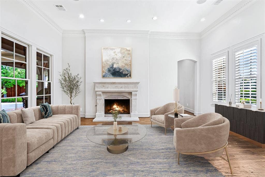 6467 Orchid Lane, Dallas, TX 75230 Virtually staged Living Room is to the right of the entry, bathed in light by 2 walls of windows with a fireplace as the focal point. The Study and Guest Suite are beyond.
