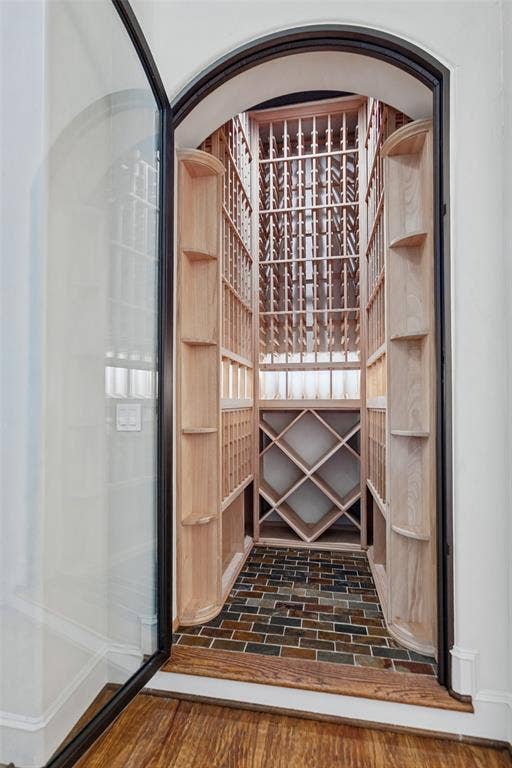 6467 Orchid Lane, Dallas, TX 75230 Climate controlled wine closet was custom designed and installed. A Solara glass door was designed to complement the front entry doors.