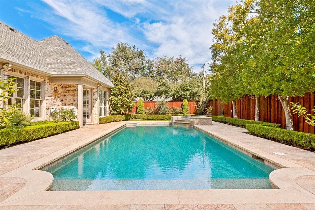 6467 Orchid Lane, Dallas, TX 75230 Sparkling linear pool with Pebble Tech finish and raised spa with fountain!