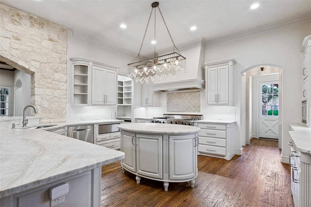 6467 Orchid Lane, Dallas, TX 75230 To the left rear is the pantry with abundant organized storage plus a task countertop for appliances.