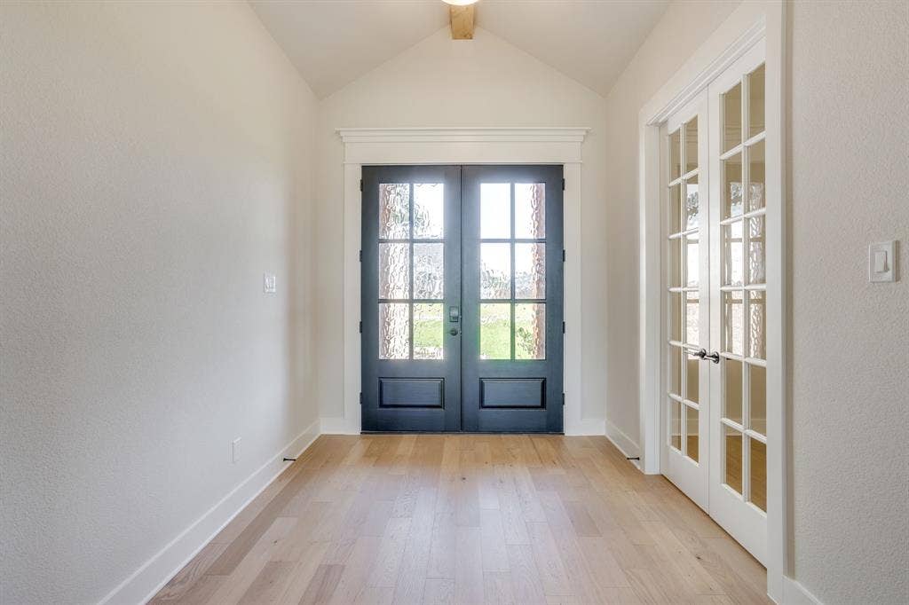 501 Olson Road, Waxahachie, TX 75167 Entryway featuring vaulted ceilings, wood-finish flooring, double-door entrance with glass paneling, and French doors with glass panes