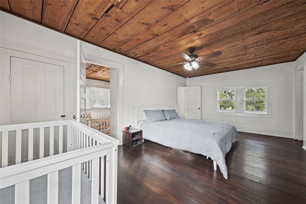 406 Summit Street, Farmersville, TX 75442 Interior space featuring exposed wood-plank ceiling, dark wood-finish flooring, and multi-pane windows
