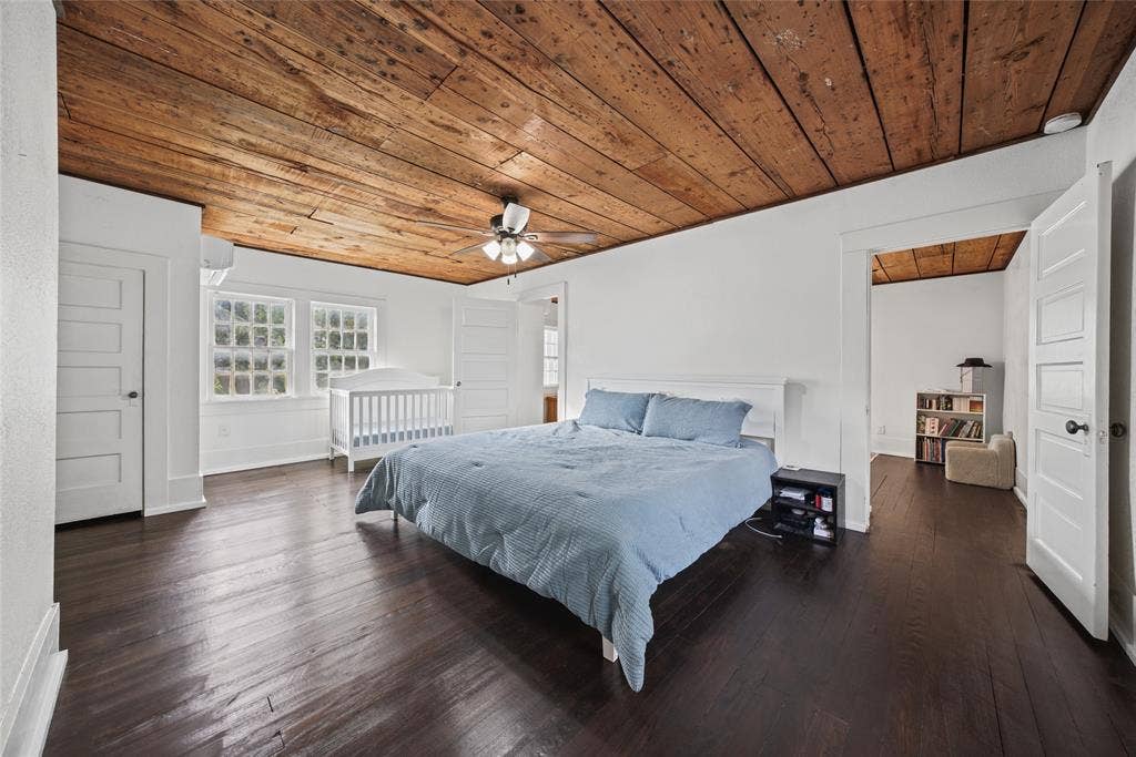 406 Summit Street, Farmersville, TX 75442 Wood-plank ceiling, dark wood-finish flooring, multi-pane windows, and five-panel interior doors