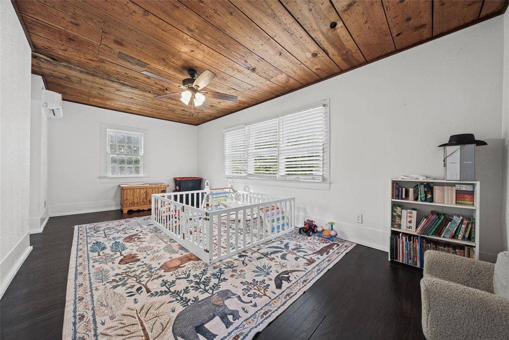 406 Summit Street, Farmersville, TX 75442 Exposed wood-plank ceiling, dark wood-finish flooring, and multi-pane windows with horizontal blinds