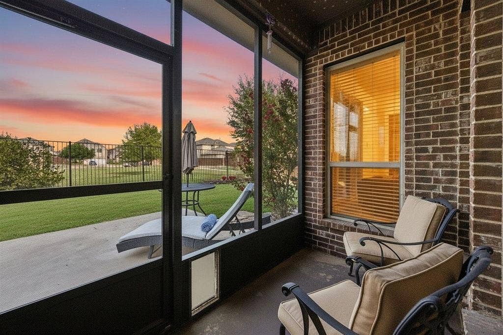 3702 Harlan Drive, Sachse, TX 75048 Screened-in back porch extends the living space outdoors with peaceful views of the greenbelt beyond the backyard.