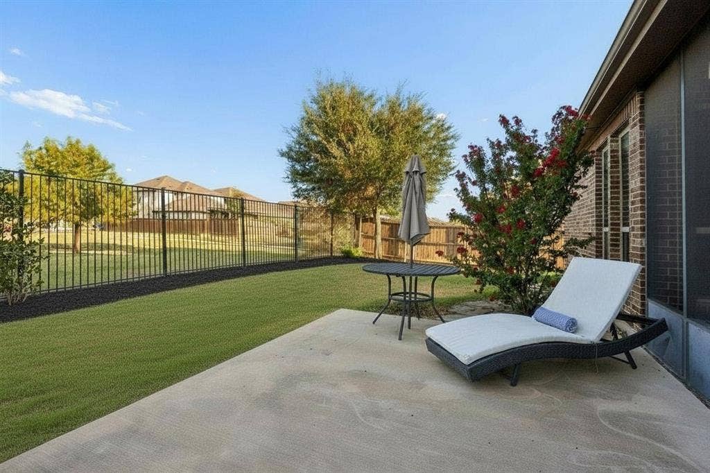 3702 Harlan Drive, Sachse, TX 75048 Enjoy an open greenbelt view, wrought iron rear fencing and extended patio space for outdoor living and entertaining.