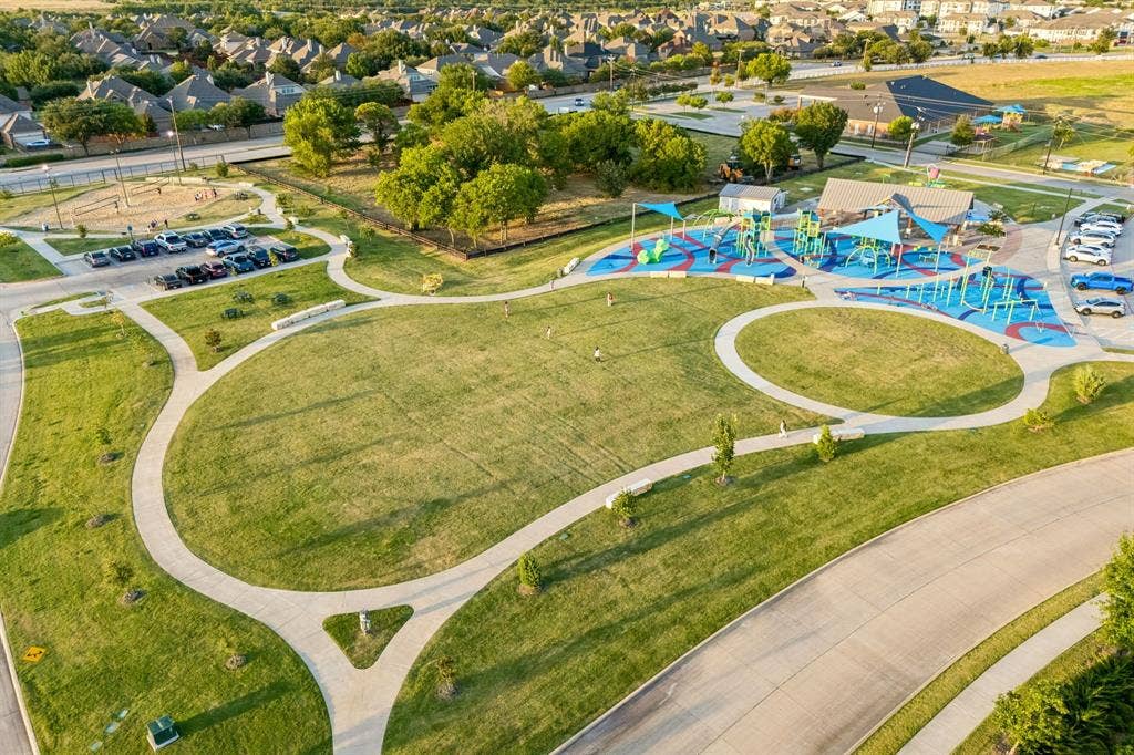 3702 Harlan Drive, Sachse, TX 75048 Nearby community green space provides additional opportunities for outdoor recreation.