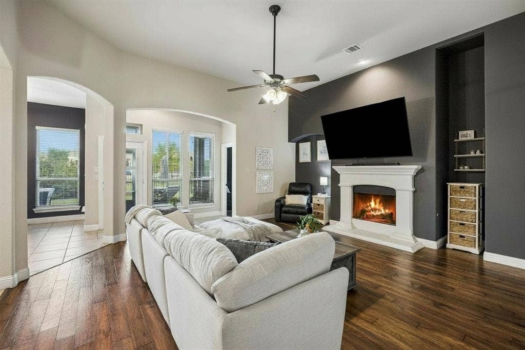3702 Harlan Drive, Sachse, TX 75048 Open-concept family room connects naturally with the kitchen and breakfast area for comfortable everyday living and entertaining.